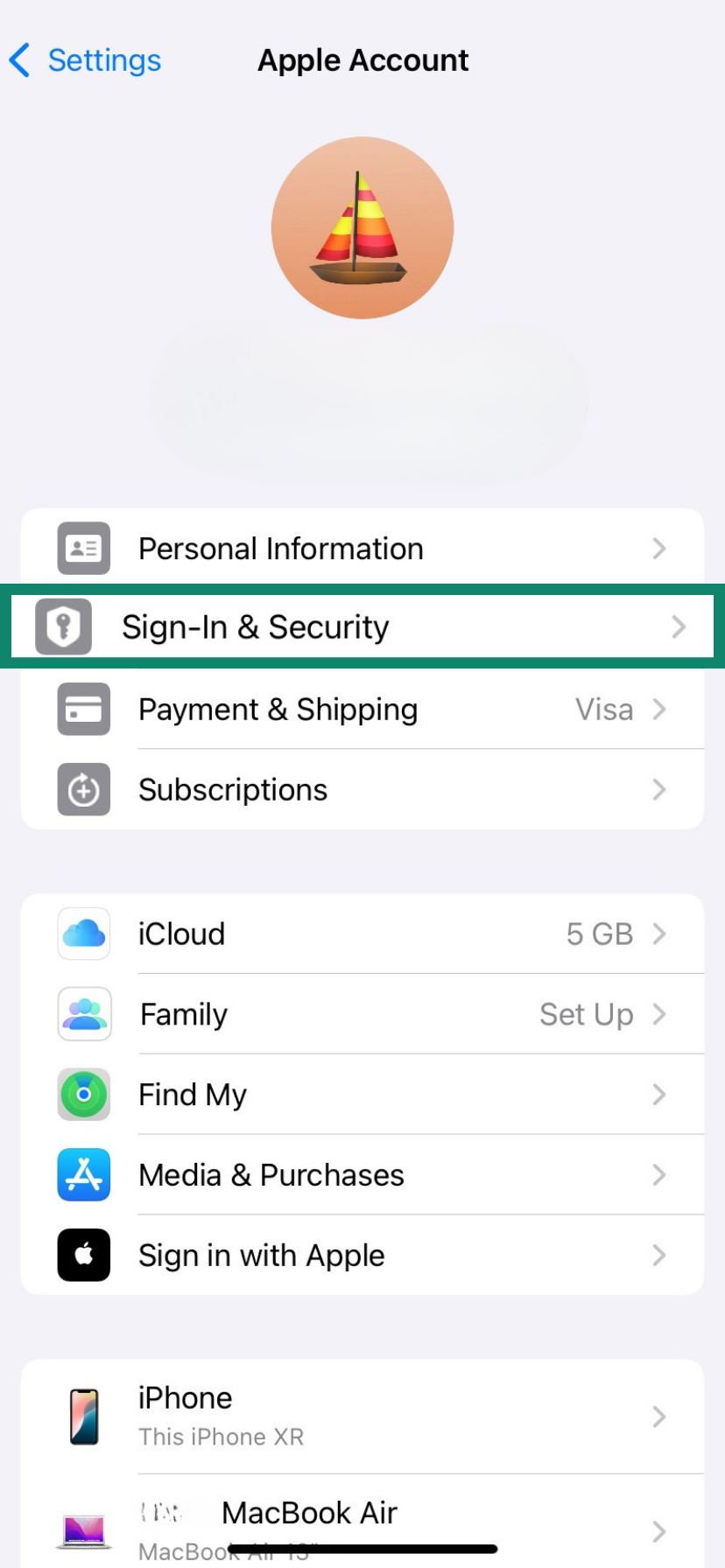 Apple Account settings with “Sign‑In & Security” highlighted; next step to open login and security options.