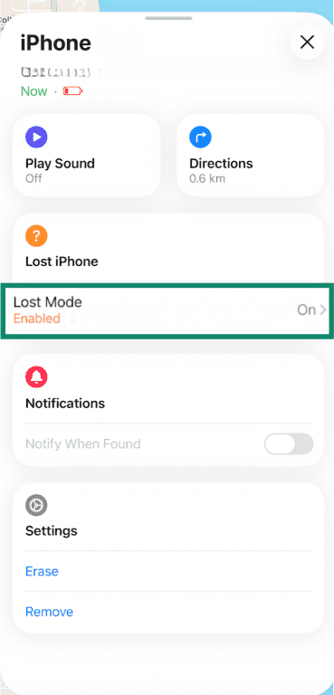 iPhone Find My app with Lost Mode button highlighted.