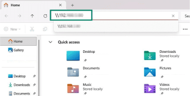 A File Explorer window, showing a Mac's IP address entered in the address bar.